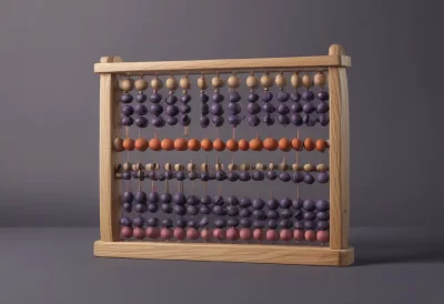 A wooden abacus with several rows of round sliding beads