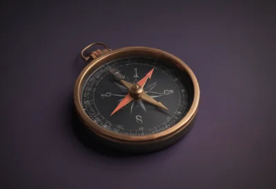 A brass pocket compass lying open with its needle settled on north