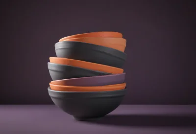 A stack of round mixing bowls of graduated sizes nested inside one another