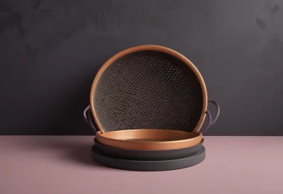 A round brass kitchen sieve with a fine mesh